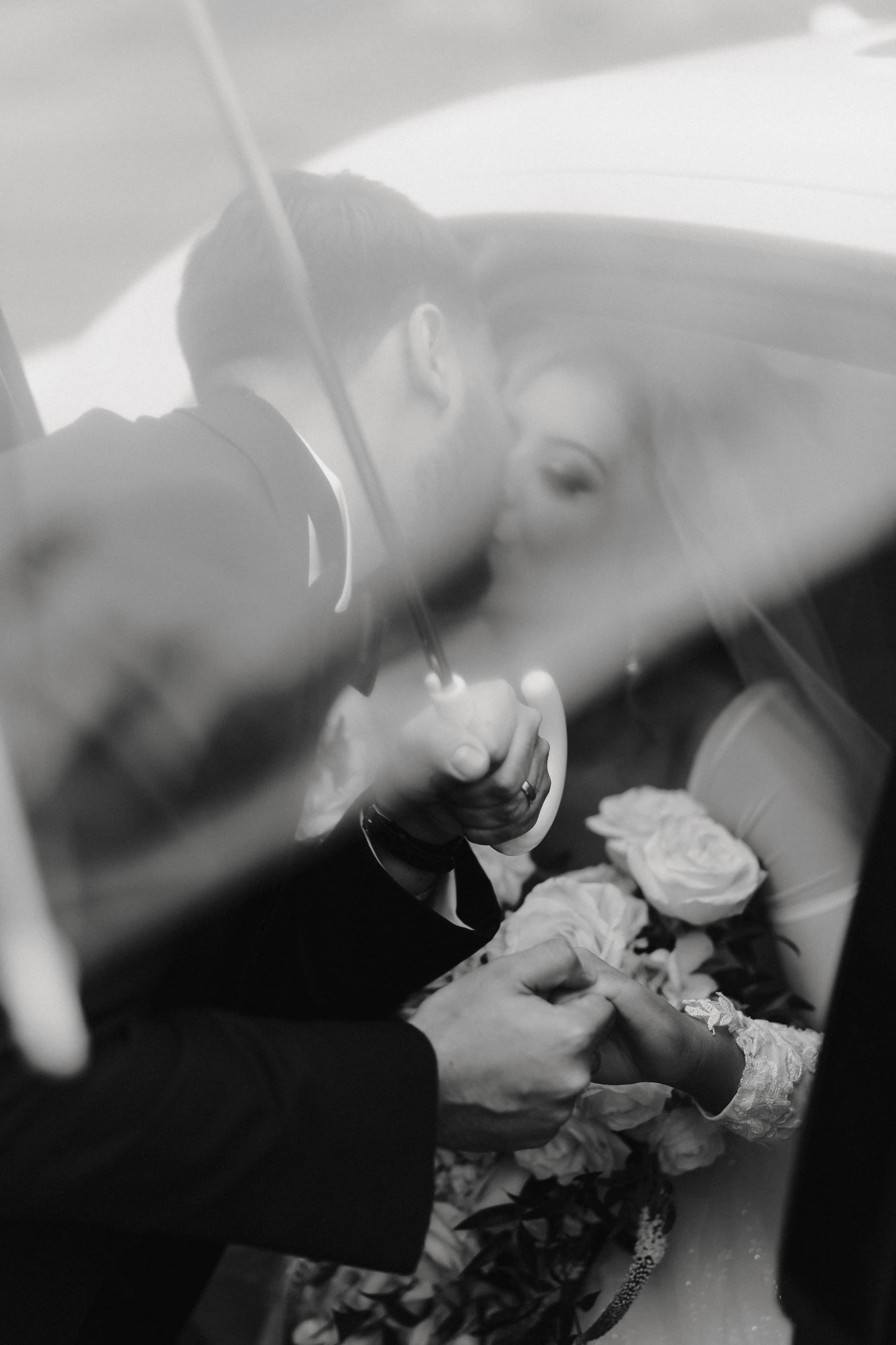 Artistic black and white veil kiss