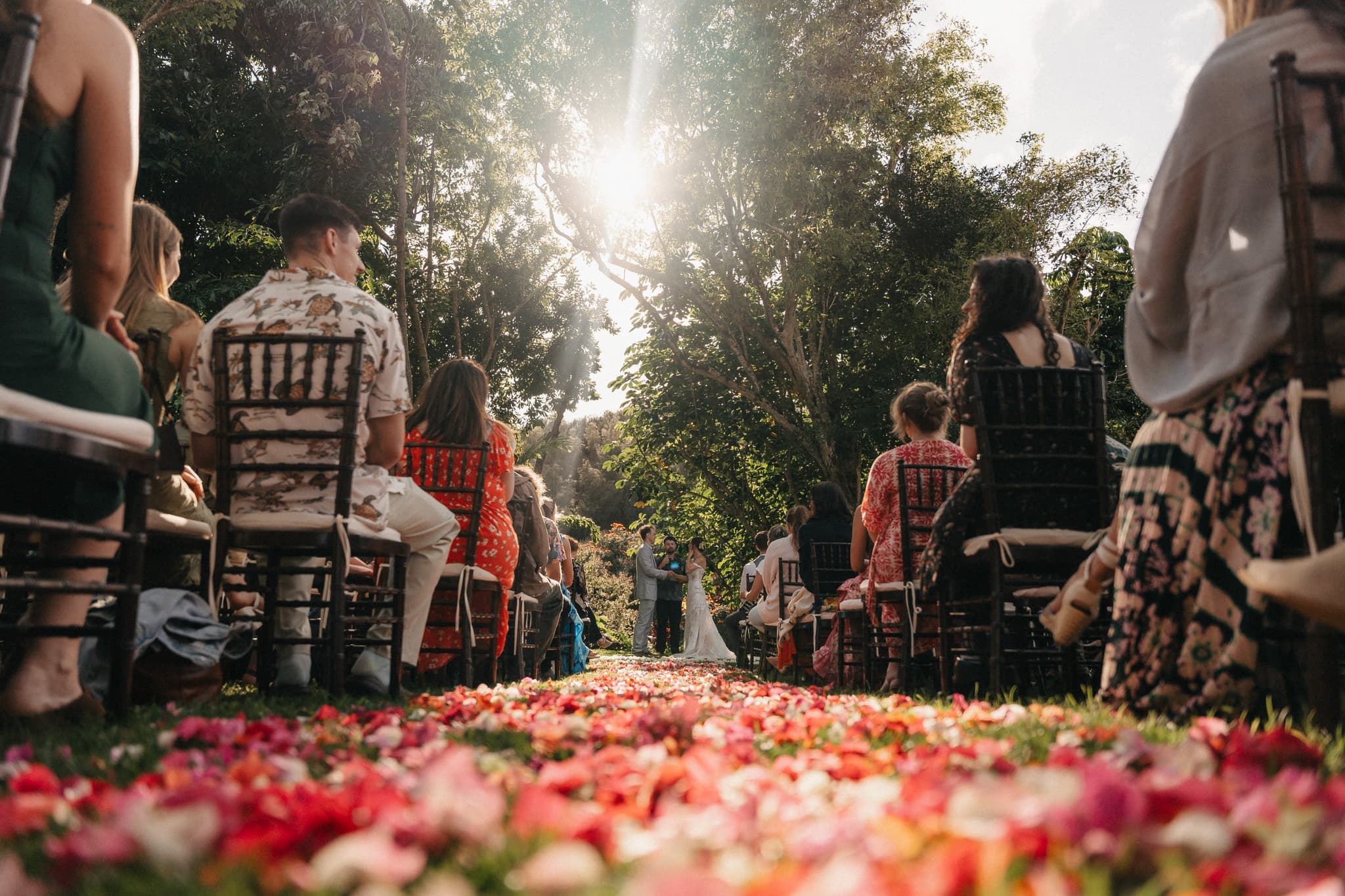 Garden ceremony with rose petal aisle