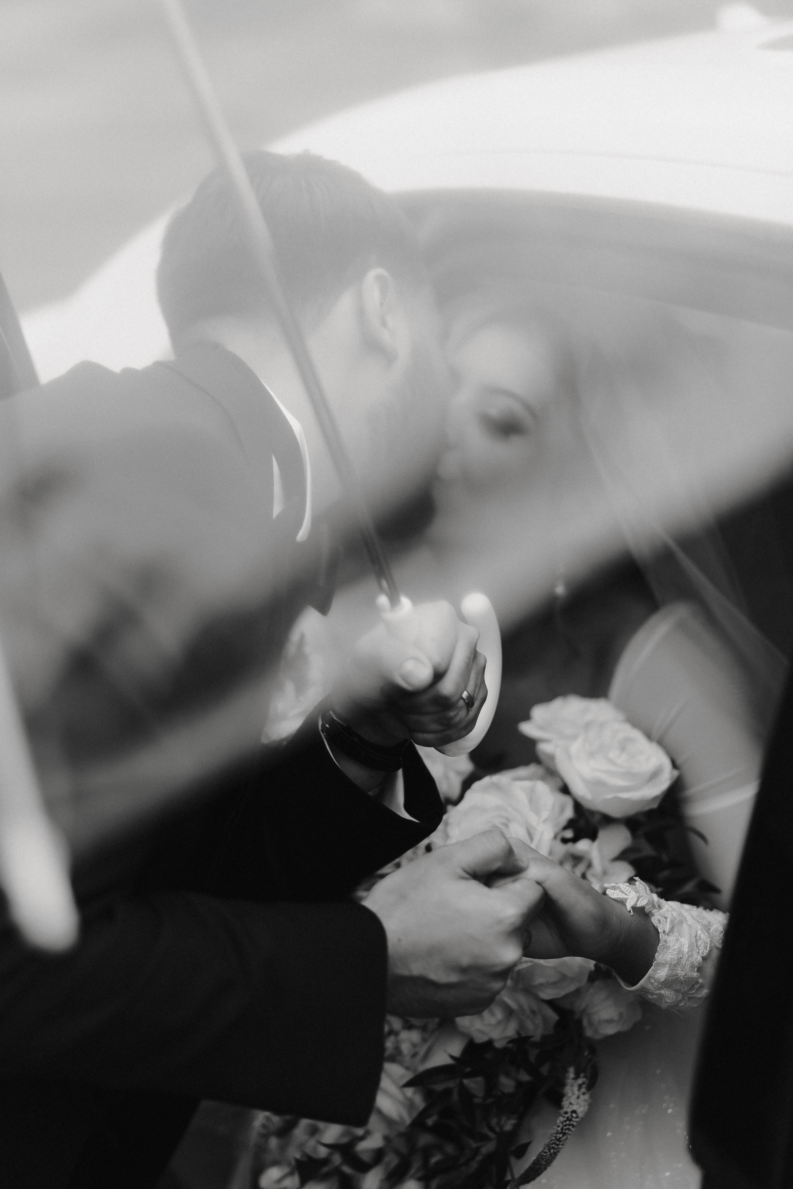 Artistic black and white veil kiss