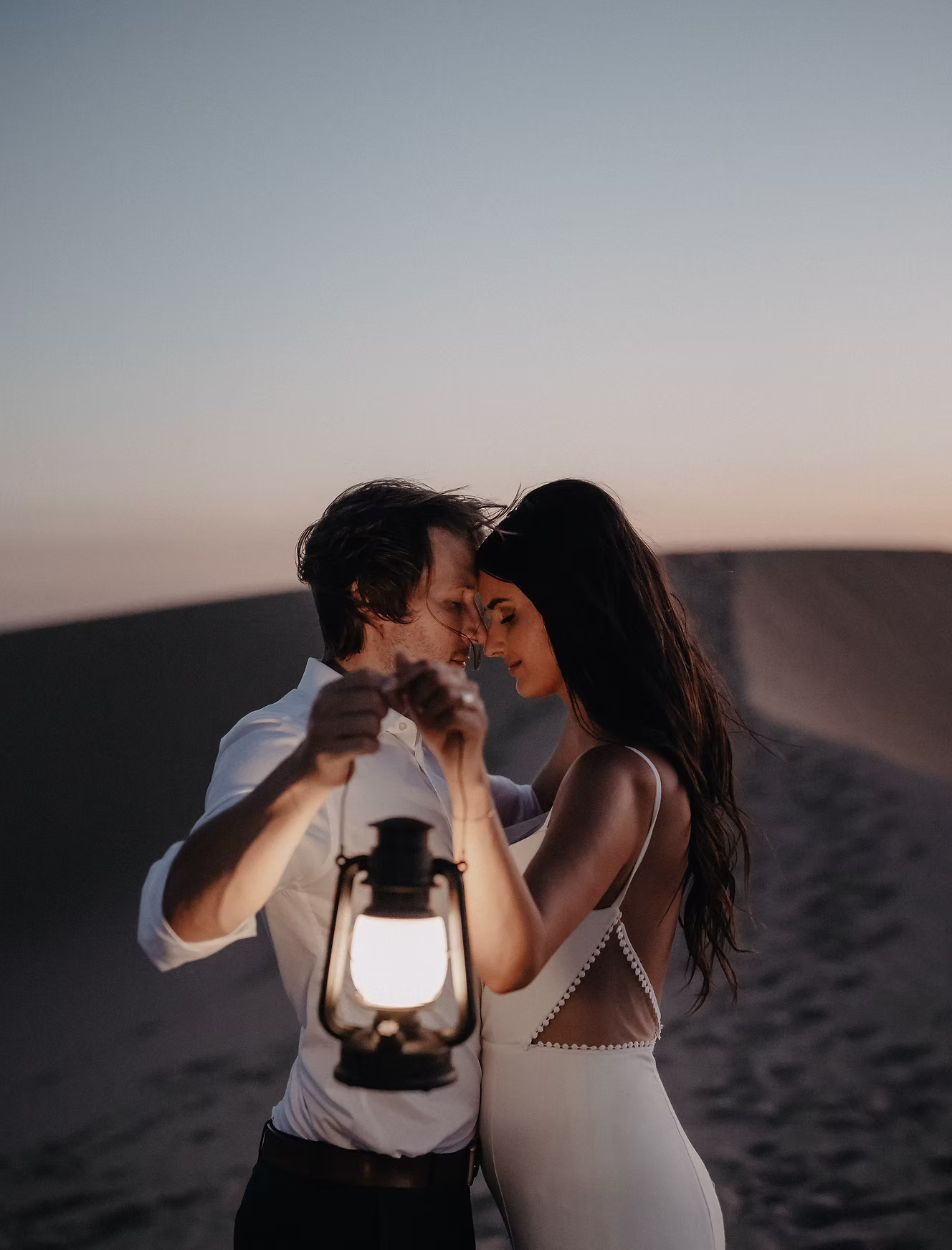 Couple at grand spiral staircase, overhead view