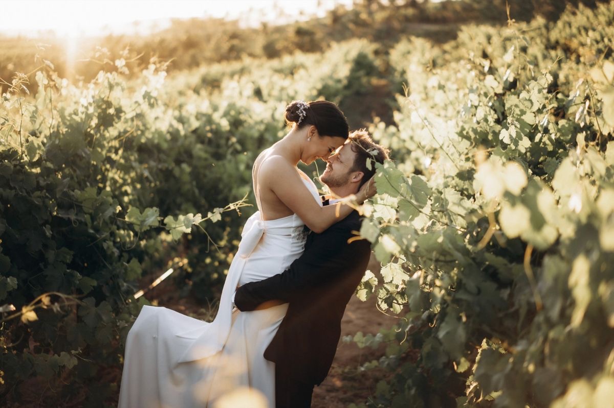 Romantic moment in vineyard golden hour